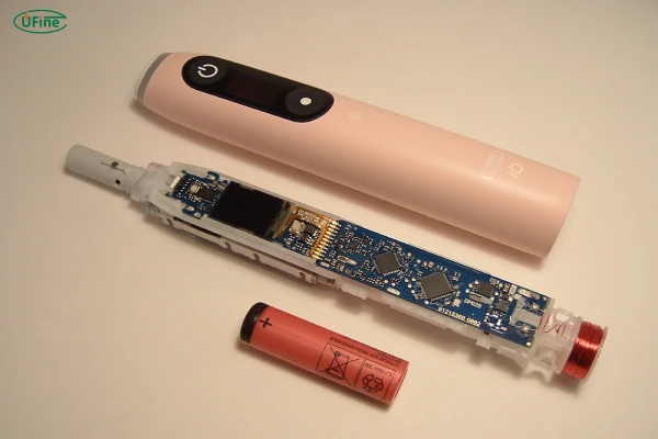 the battery inside an electric toothbrush