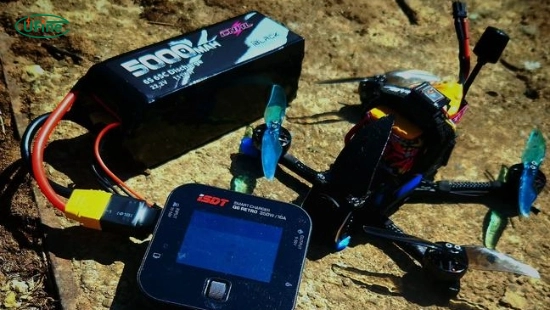 FPV drone battery charging and storage safety guide showing balance charger, storage voltage, and fireproof bag